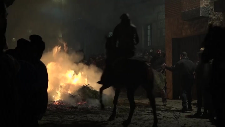 Horses jump through bonfire in Spanish purification ceremony