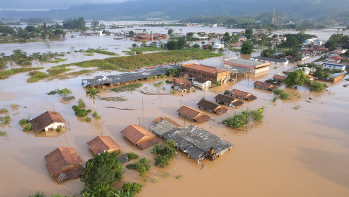 Families rescued from rooftops as deadly floods hit Brazil