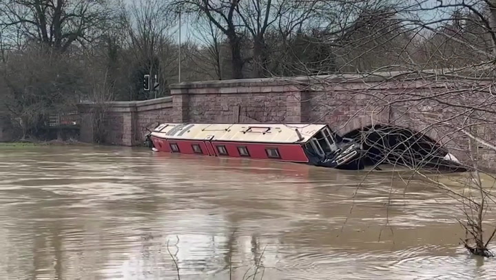 Narrowboat trapped against bridge following heavy downpours in Leicestershire