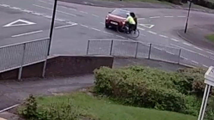 Moment elderly cyclist catapulted through air after being hit by car