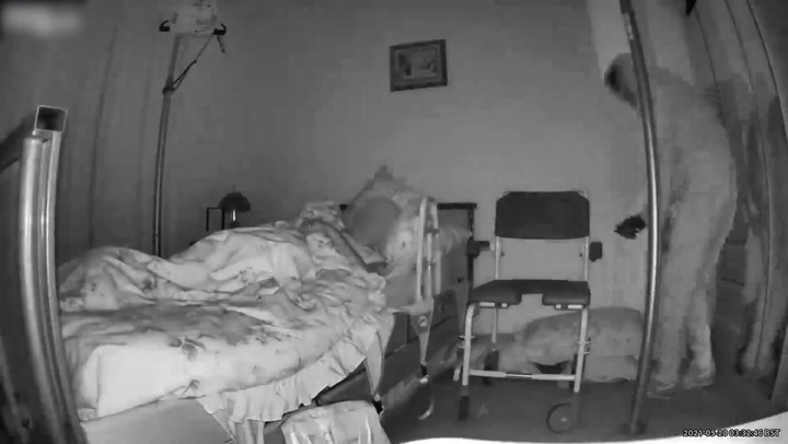 Chilling moment disabled woman who can’t move watches as burglar creeps into her room