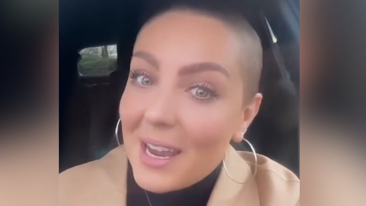 Amy Dowden shows off hair growth as she returns to hospital