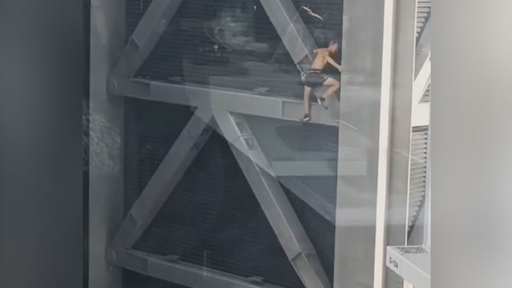 Topless daredevil climbs 225 metre-tall Cheesegrater skyscraper with no ropes