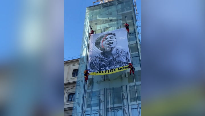 Greenpeace activists unfurl banner at Madrid museum to demand Gaza ceasefire