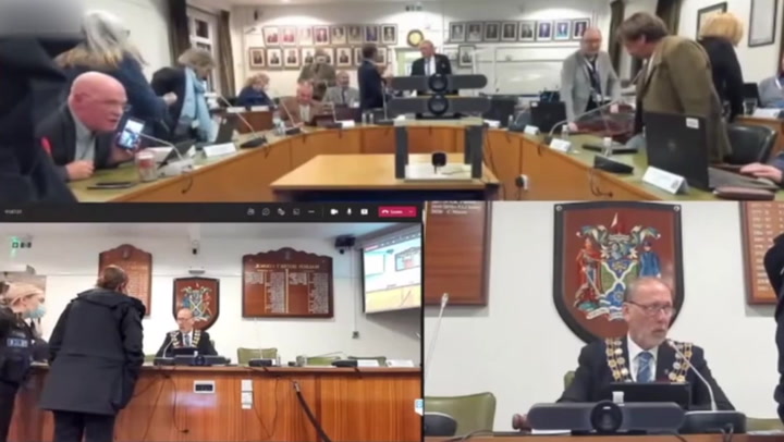 Council meeting descends into chaos as megaphone used during furious row between councillors