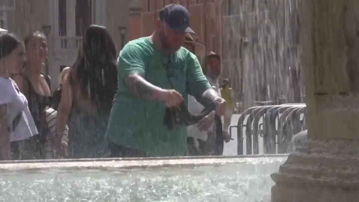 Visitors to the Vatican seek respite from heat by washing clothes in fountains