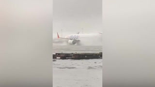 Plane battles flood at Dubai airport as rain causes flight disruption