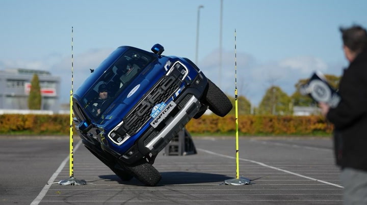 UK stuntman breaks world record for driving truck on two wheels through tiny gap