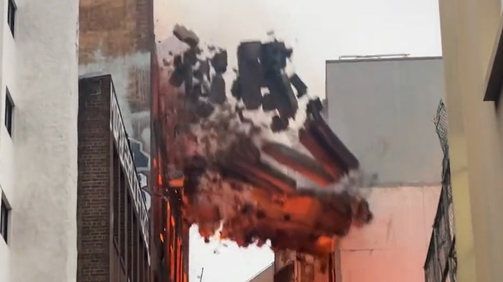 Wall crumbles as massive fire engulfs seven-storey building in Sydney
