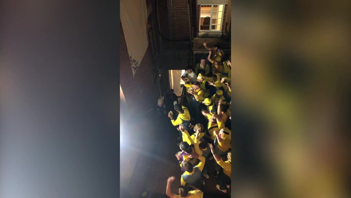 70 people dressed as Despicable Me Minions cheer as Gru arrives