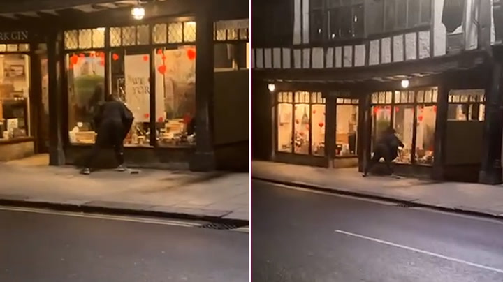 Moment thief smashes window of 400-year-old York shop to steal bottles of gin