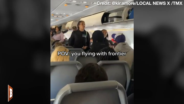 Woman CARRIED Off Frontier Flight Allegedly Tried to BITE Officers