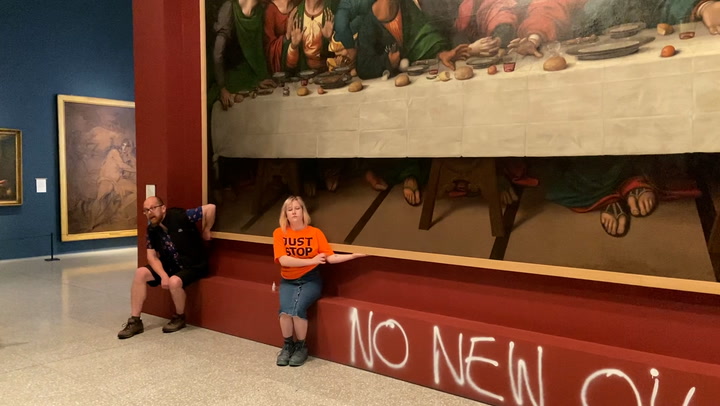 Just Stop Oil activists glue themselves to frame of The Last Supper painting