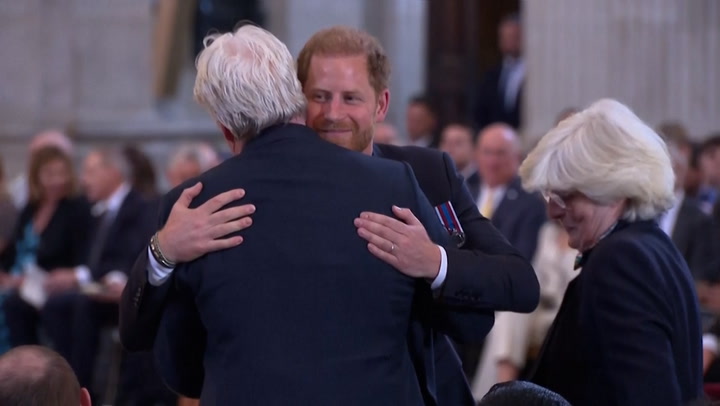 Prince Harry hugs family as he is supported by Princess Diana's brother and sister at Invictus Games ceremony
