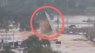 Ferry gets obliterated when Brazil floods carry it into submerged bridge