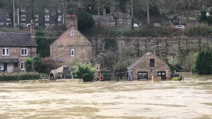 Houses alongside River Severn get flooded after high winds and wet weather hit UK