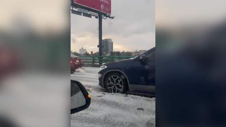 Cars stuck in sleet and snow after freak hailstorm in Mexico City