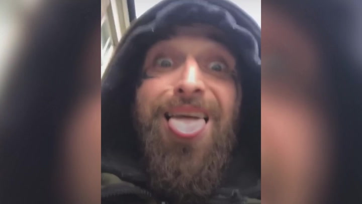'Let the games begin': Wanted man taunts police by filming himself outside police stations