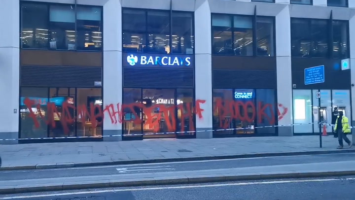 240220-2barclays Building In London Covered In Red Spray-painted Graffiti-