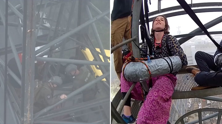 Two activists tape themselves on top of 250ft crane in 'Cop City' protest