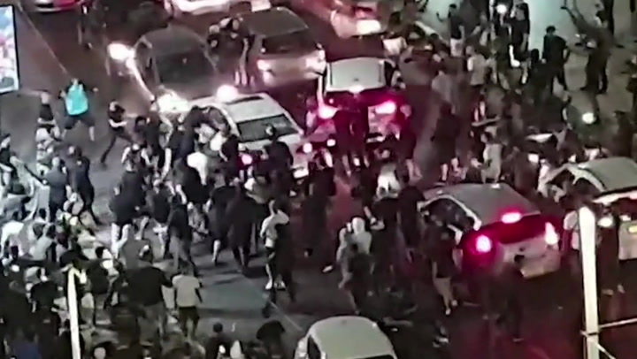 Israeli mob drag man they believe to be Arab from car and beat him unconscious