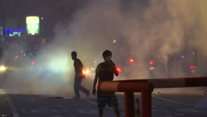 Thai riot police use water cannons, rubber bullets and tear gas at protest