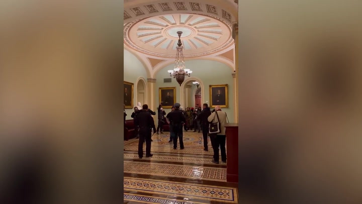 Hero officer leads pro-Trump mob away from Senate chamber during Capitol riot