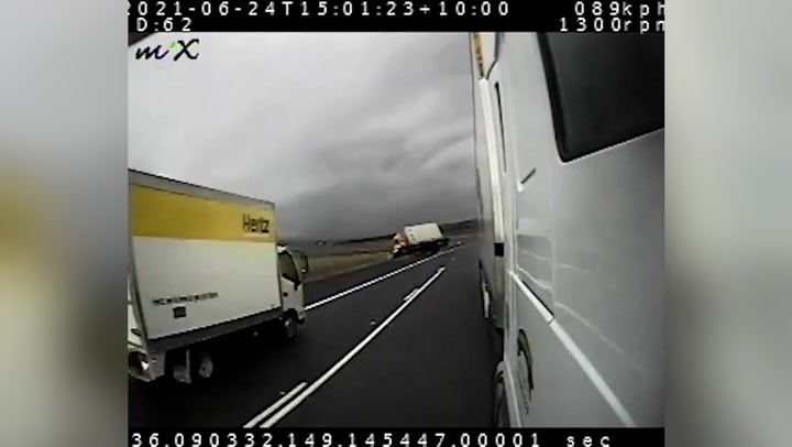 Moment lorry flips over on Australian highway