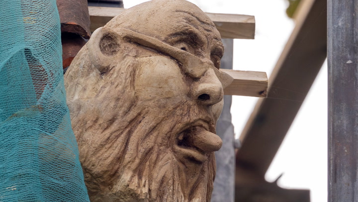 Angry builder erects gargoyle of council chief as planning row turns ugly