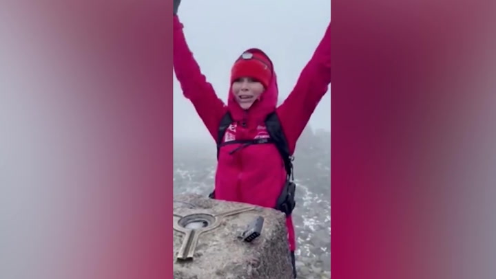 Amanda Holden pops champagne on top of UK's highest mountain Ben Nevis