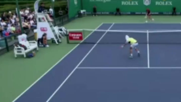 Frustrated tennis player smashes ball at umpire's head after losing match point