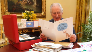 Watch King Charles laughing as he opens cards from public