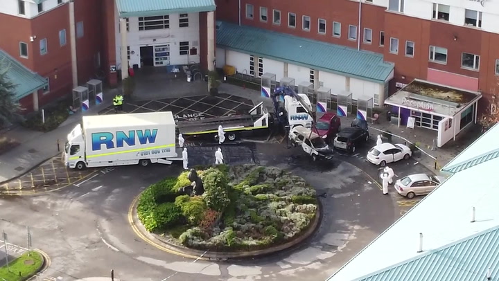 Liverpool bomb attack: Burnt-out taxi removed from outside hospital 