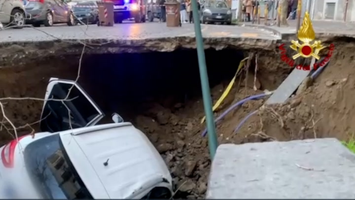 Sinkhole traps cars in huge crater on Naples street