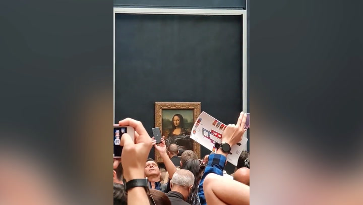 'Mona Lisa' painting smeared with cake by man disguised
