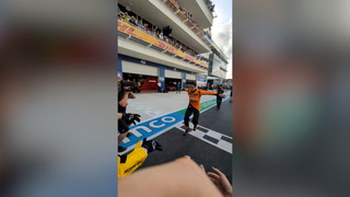 Lando Norris crowd surfs in behind the scenes footage from F1 win