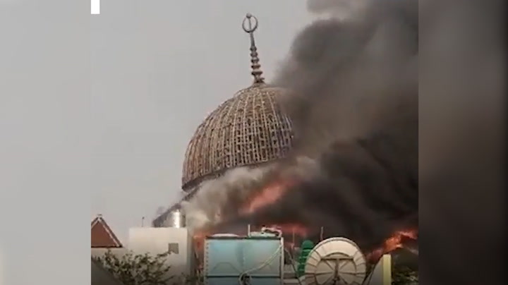 Burning mosque collapses after huge fire in Indonesia