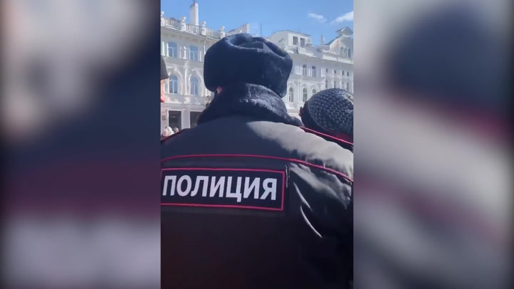 Russian police arrest demonstrator protesting with blank sign