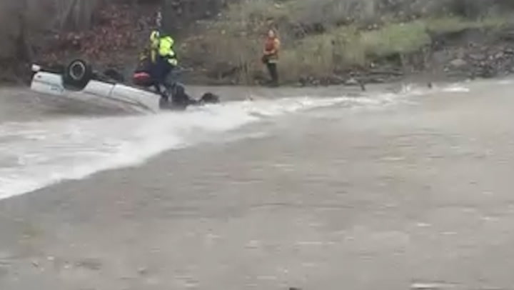 Woman stranded in raging creek for 15 hours rescued from overturned truck