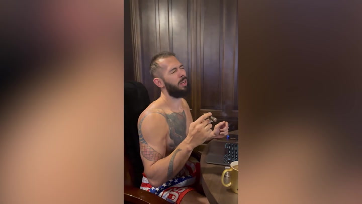 Andrew Tate smokes cigar while listening to Mariah Carey after being released from prison