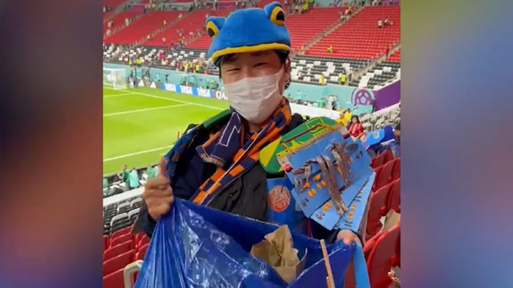 Japanese fans clear away rubbish left after World Cup game in Qatar