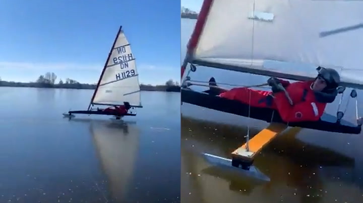Man sails on frozen Netherlands lake in magical scene