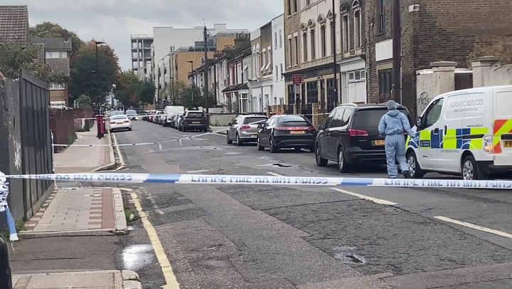 London road cordoned off after stabbings leave one dead and one injured