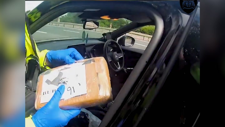 Driver acts surprised when police tell him there is 10kg of cocaine in front of car