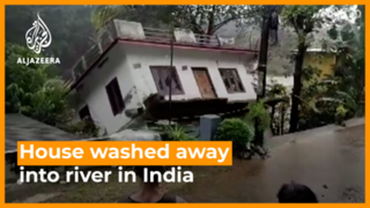 House washes away by rushing river amid India landslide