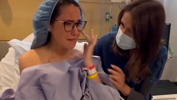 Olivia Munn reveals breast cancer diagnosis and shares video from hospital bed