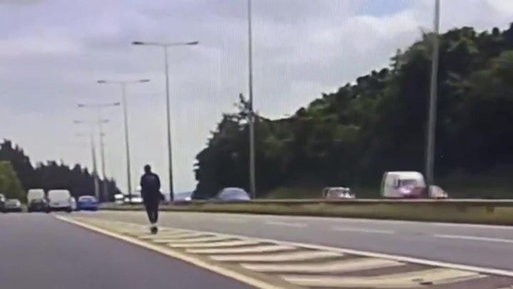 Bizarre footage shows someone on an e-scooter trying to join the motorway