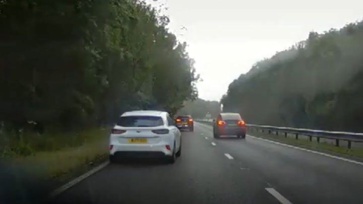Dangerous driver fleeing police at more than 100mph almost crashes into motorist