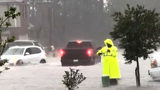 Truck struggles through flooded road as heavy rainfall inundates Texas