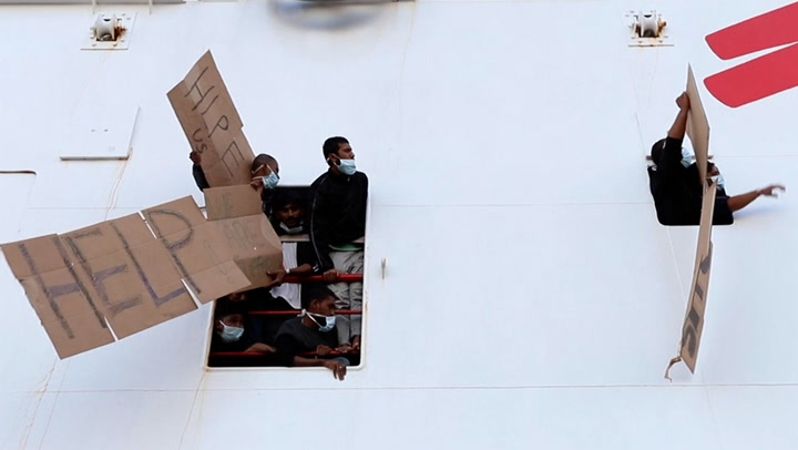 Migrants plead for help as they are blocked from disembarking rescue ship in Sicily